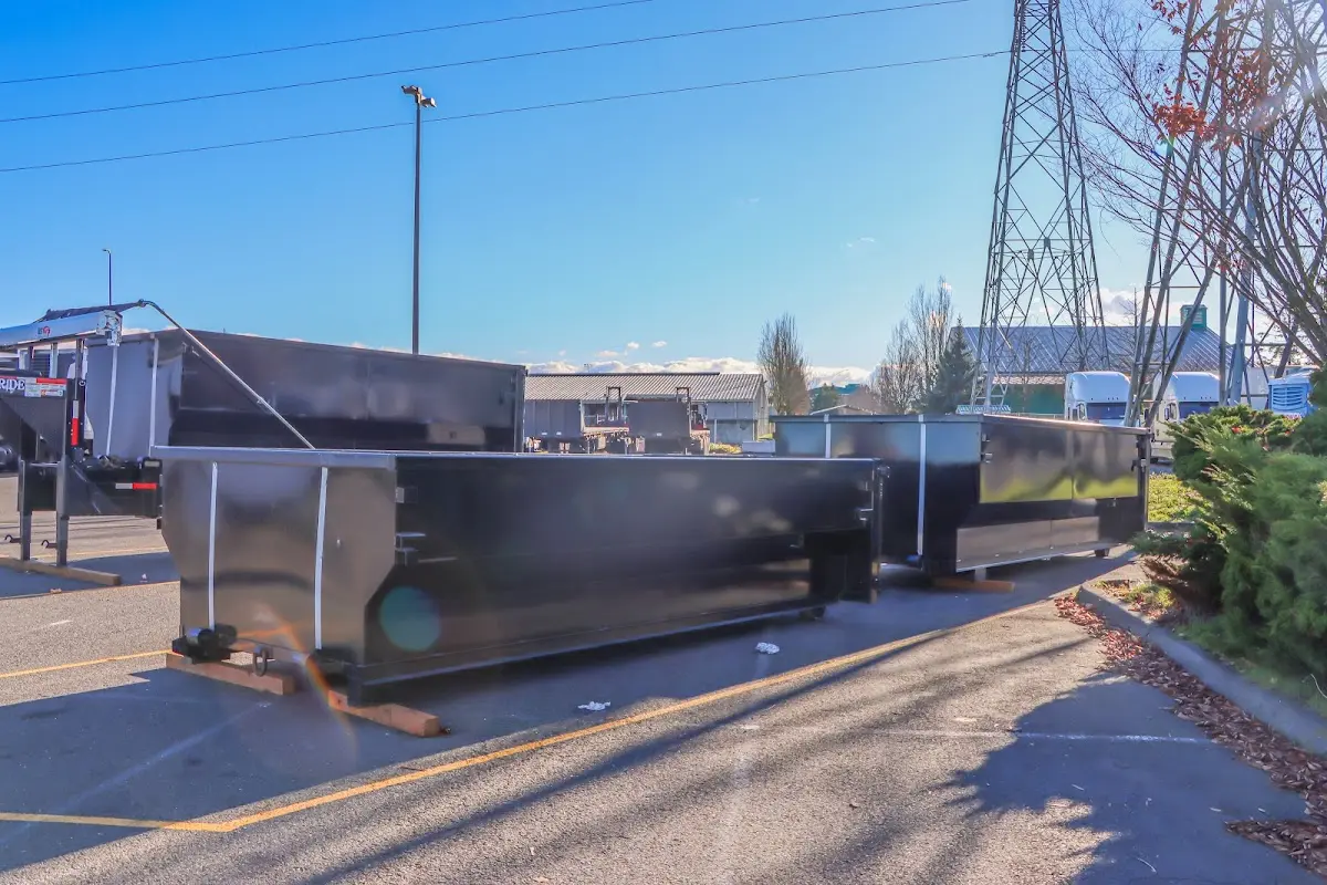 Roll-off dumpster ready for waste disposal at job site for Demolition Dumpster Rental in Gun Barrel City